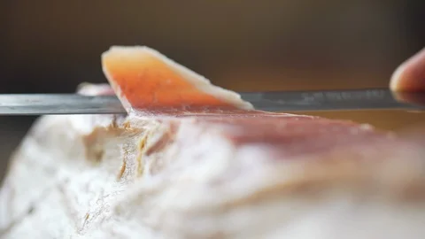Super macro closeup of cutting traditional Italian or Spanish ham, tasty food. Stock-Footage 94875409