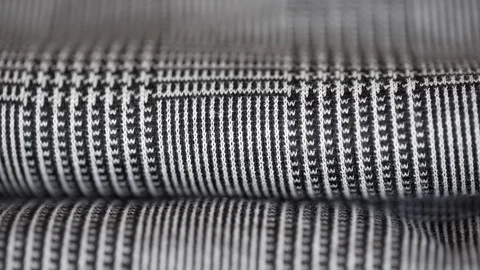 Super macro closeup shot of elegant houndstooth pied de poule fabric folded. Stock Footage 95546531