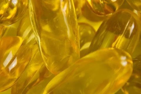 Super macro of cod liver fish oil capsules Stock Photos
