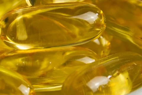 Super macro of cod liver fish oil capsules Stock Photos