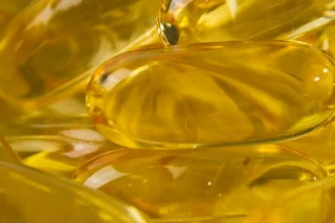 Super macro of cod liver fish oil capsules Stock Photos
