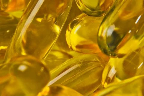 Super macro of cod liver fish oil capsules Stock Photos