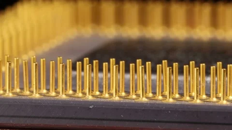 Super macro detail of rotating computer microprocessor's in-lined connection pin Stockbeeldmateriaal 172416759