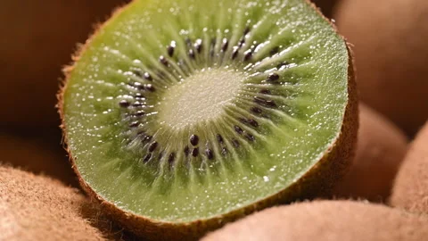 Super macro of fresh kiwi slice slowly rotating. Stock Footage 330470643