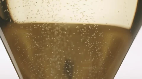 Super macro shot of tiny air bubbles flowing upwards in elegant glass Stock Footage 270516540