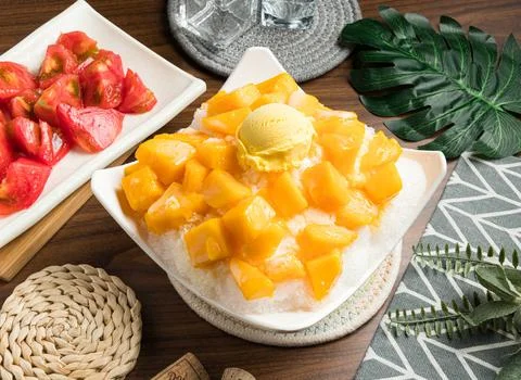 Super Mango Ice cream served in bowl isolated on table side view of taiwan fo Stock Photos
