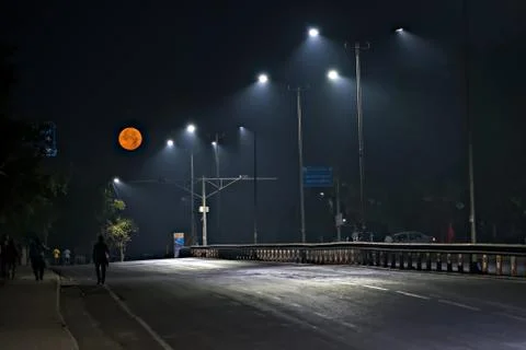 Super-moon image with empty street early in the morning. Stock Photos
