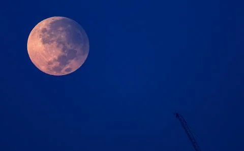 The super moon rises during partial lunar eclipse in Dubai, United Arab Emirates Stock Photos