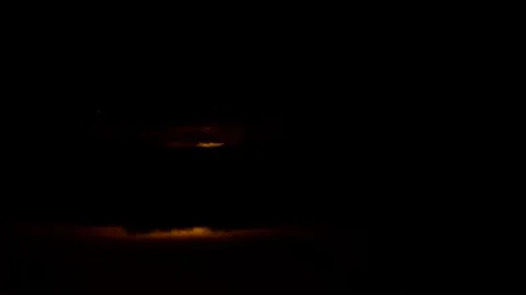 Super Moon rising through clouds (Timelapse) Stock Footage 70172937