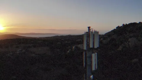 Super noisy interference scenic antenna telecommunication tower valley view Stock Footage 116343528