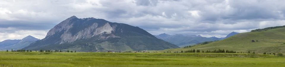 Super panoramic view of Mt Crested butte landscape in Colorado with cloudy sk Stock Photos
