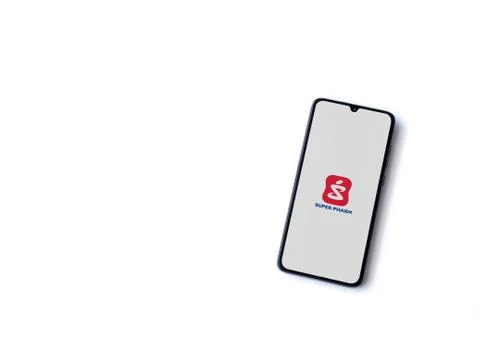 Super Pharm app launch screen with logo on the display of a black mobile smar Stock Photos