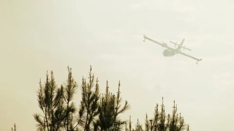 Super Scooper plane flying through hazy sky 3 Stock-Footage 54642248