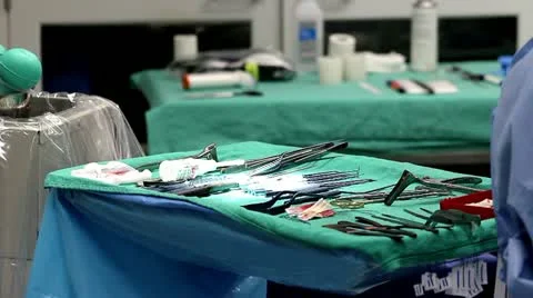 Super shallow depth of field of instruments table during surgery Stock Footage