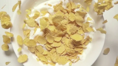 Super slow mo 960fps cornflakes  falling in milk top vie Stock Footage 72304264