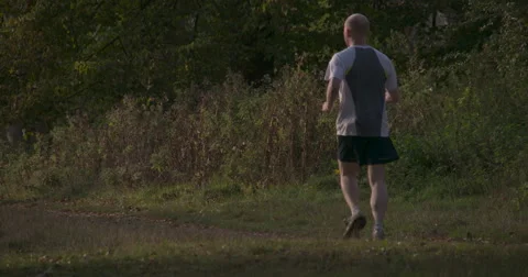Super Slow Mo: Autumn evening Jogger 4K Stock Footage 42934800