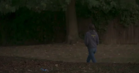 Super Slow Mo: Autumn Walking Girl &amp; Rubbish 4K Stock Footage 42943781