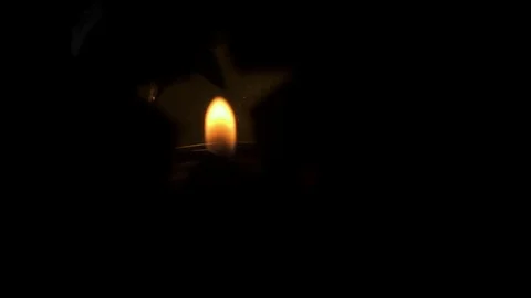 Super Slow Mo candlelight close-up in a festive ceramic candle holder Stock Footage 82718599