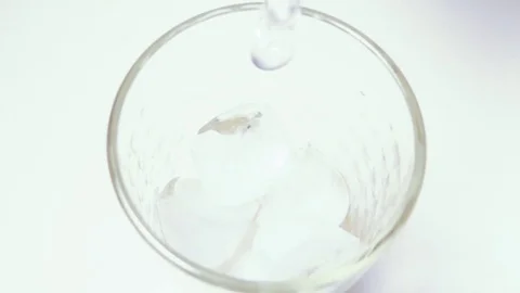 Super slow mo ice water being poured into glass Stock-Footage 72273959