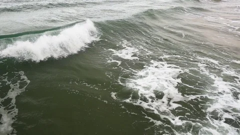 Super slow mo top view of the foam from the wave Stock Footage 82867528