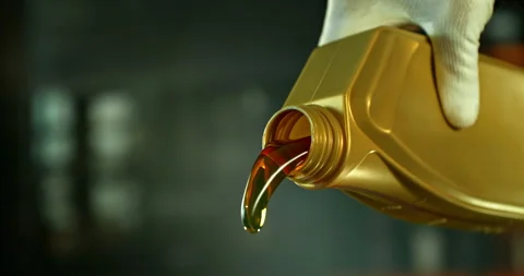 Super slow motion (1000 fps) shot of motor oil pouring from a container Stock Footage 332765299