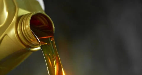 Super slow motion (1000 fps) close-up of motor oil pouring from a container. Stock Footage 332765468
