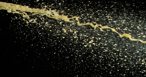 Super slow motion (1000 fps) gasoline splashing in mid-air on dark background. Stock Footage 333326151