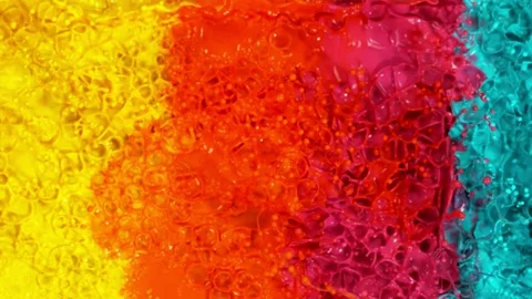 Super slow motion of abstract colored splashes explosions filmed from top. Stock Footage 138013980