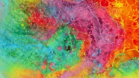 Super slow motion of abstract colored splashes explosions filmed from top. Stock Footage 138015842