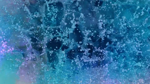 Super slow motion of abstract colored splashes explosions filmed from top. Stock Footage 138041674