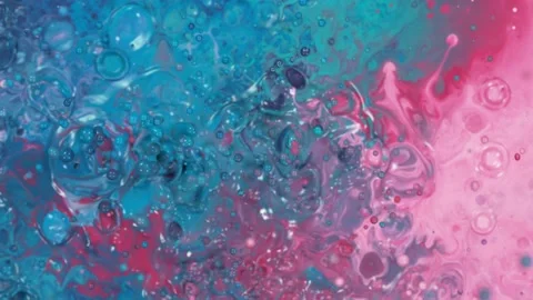 Super slow motion of abstract colored splashes explosions filmed from top. Stock Footage 138043217