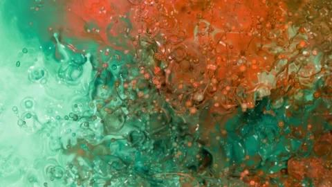 Super slow motion of abstract colored splashes explosions filmed from top. Stock Footage 138043737