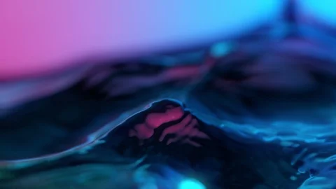 Super Slow Motion Abstract Shot of Swirling Neon Water at 1000fps. Stock Footage