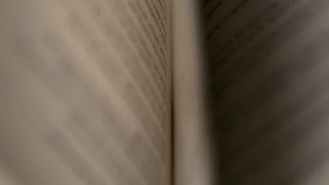 A Super Slow Motion Abstract Shot of Pages Turning in a Book Stock Footage 270401035