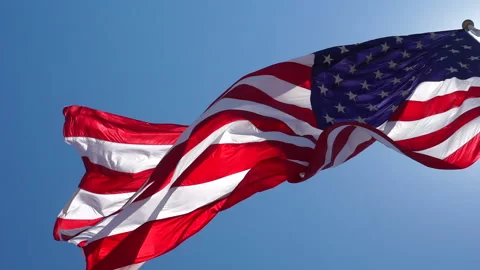 Super slow motion of American flag blowing overhead  Stock Footage 199318651