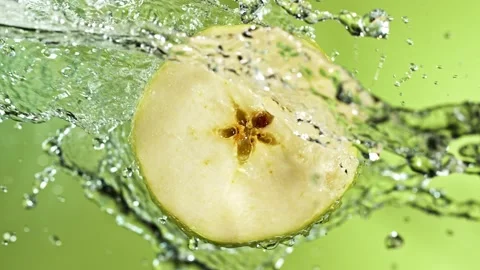 Super Slow Motion of Apple Slice With Water Splashes. Stock Footage 201189209