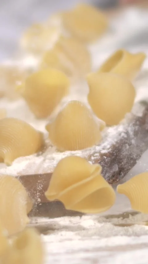 Super slow motion, Artisan Chef Drops Shell Pasta In Super Slow Motion Video stock 331233377