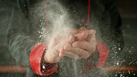 Super Slow Motion of a Baker Clapping His Hands and Throwing Flour Around. Video stock 306653824