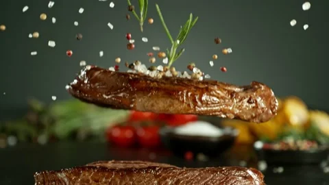Super slow motion of beef steaks falling down. Stock Footage 237316879