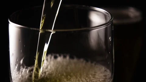 Super slow motion beer pouring into a glass of Stock Footage 72590066