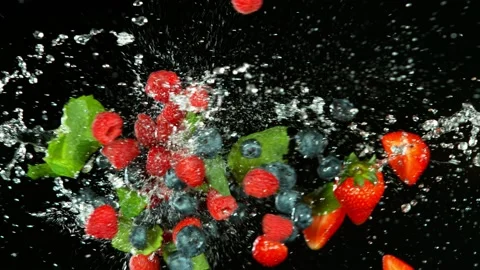 Super slow motion of berries fruit flying up in the air with water splashes. Stock Footage 133253514