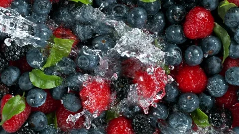 Super slow motion of berries with splashing water, top view Stock Footage 149765553