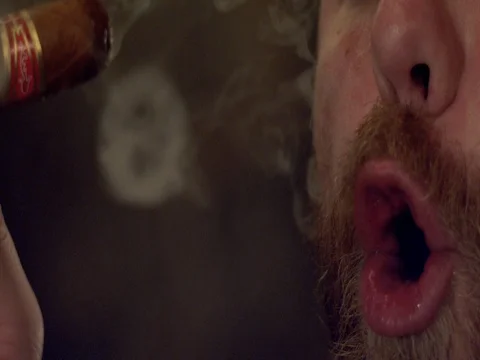 Super Slow Motion Blowing Smoke Rings with Cigar Stock Footage 71508062