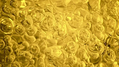 Super slow motion of bubbling golden liquid in detail. Stock Footage 254893047