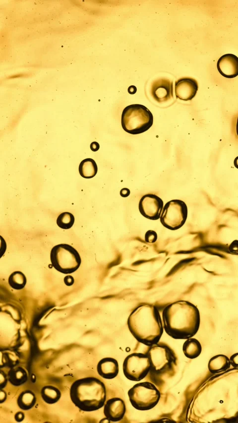 Super Slow Motion of Bubbling Golden Liquid in Detail. Stock Footage 289008043