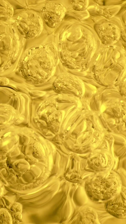 Super Slow Motion of Bubbling Golden Liquid in Detail. Stock Footage 306656622