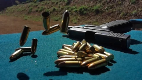 Super slow motion Bullets droping/Falling Glock background Stock Footage 124360113