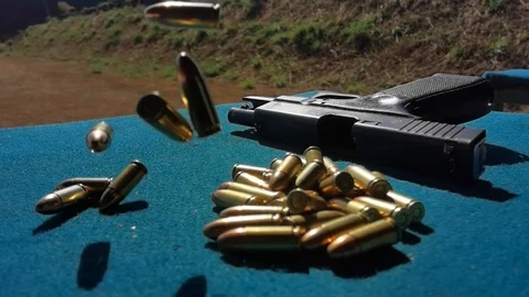 Super slow motion Bullets droping/Falling Glock background Stockbeeldmateriaal 124360127