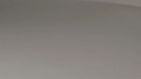 Super slow motion of a bunch of coins falling on a table Stock Footage 117626379
