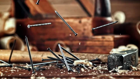 Super slow motion a bunch of nails fall on the table Stock Footage 271288295